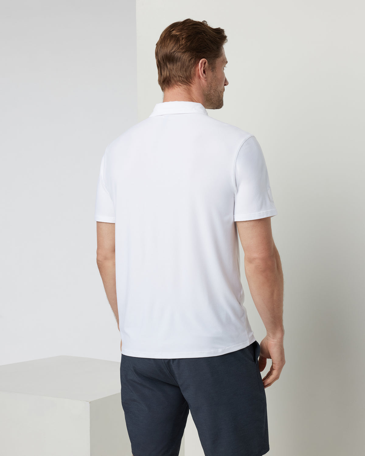 Strato Tech Polo Men's White Athletic Polo | Vuori onsale